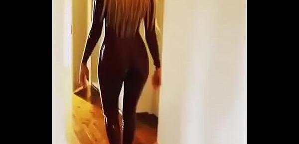  Sexy babe walks in latex catsuit